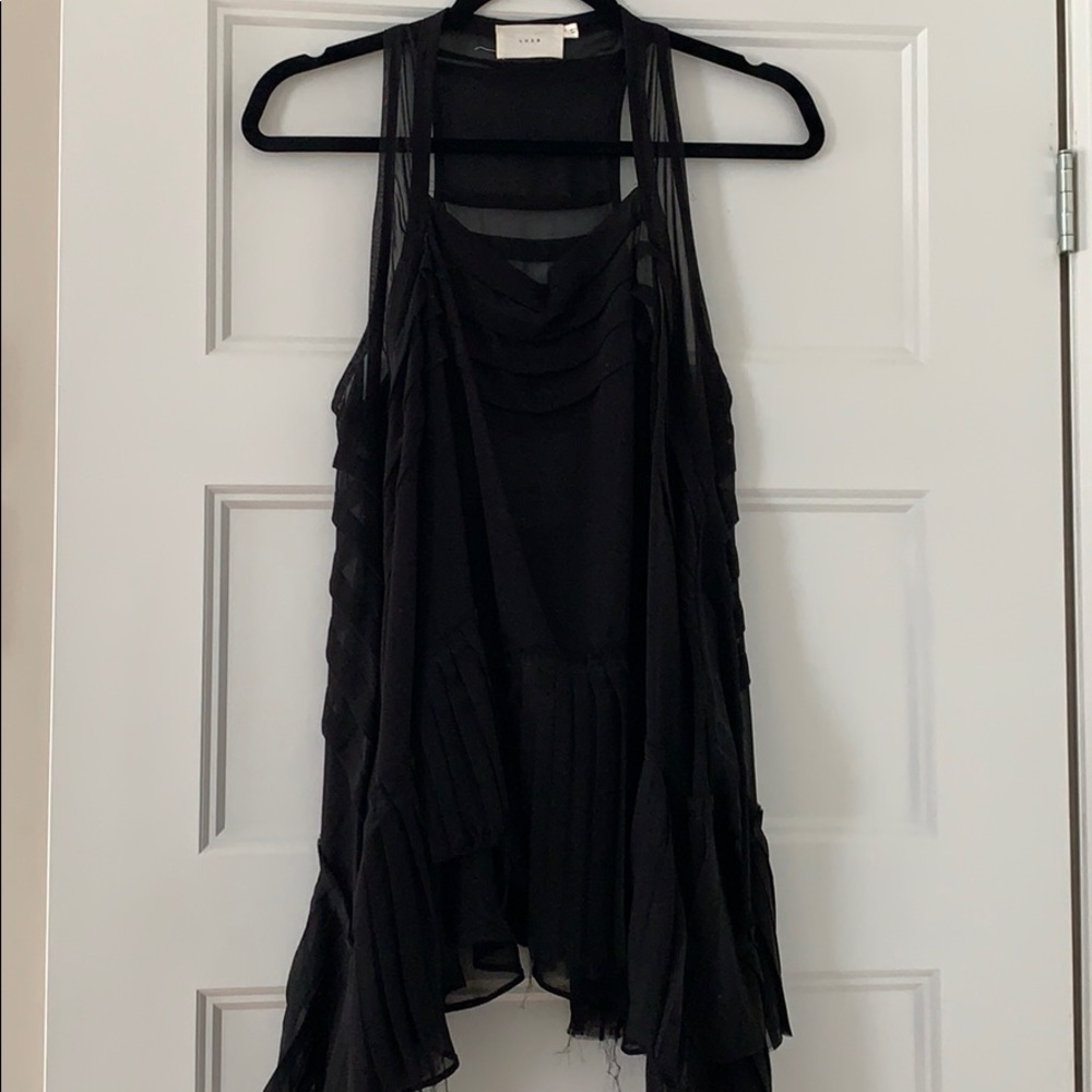 Sleeveless flowy blouse with beautiful detailing